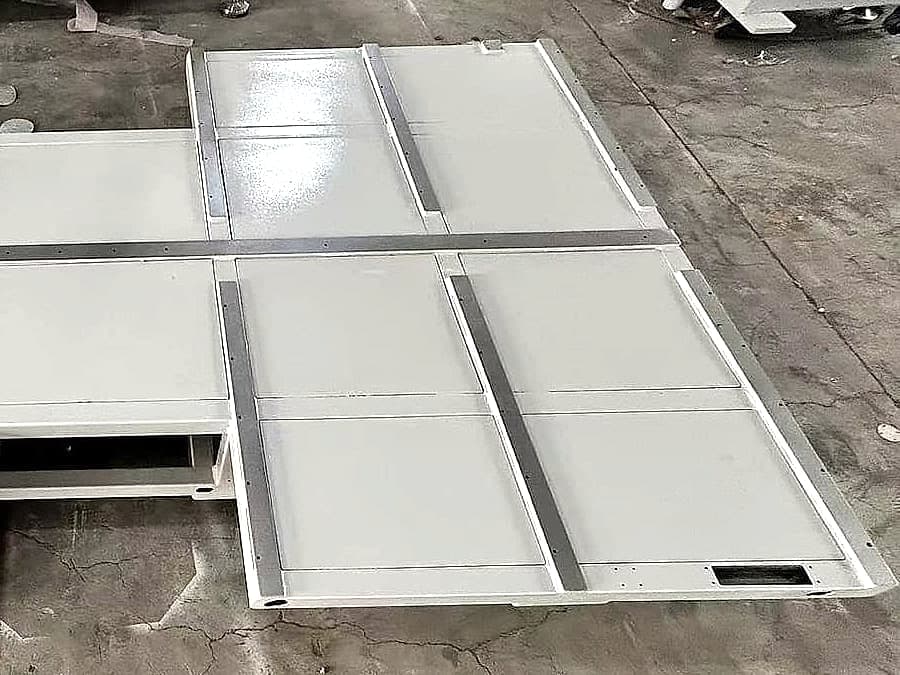White metal panels with visible edges and folded sections