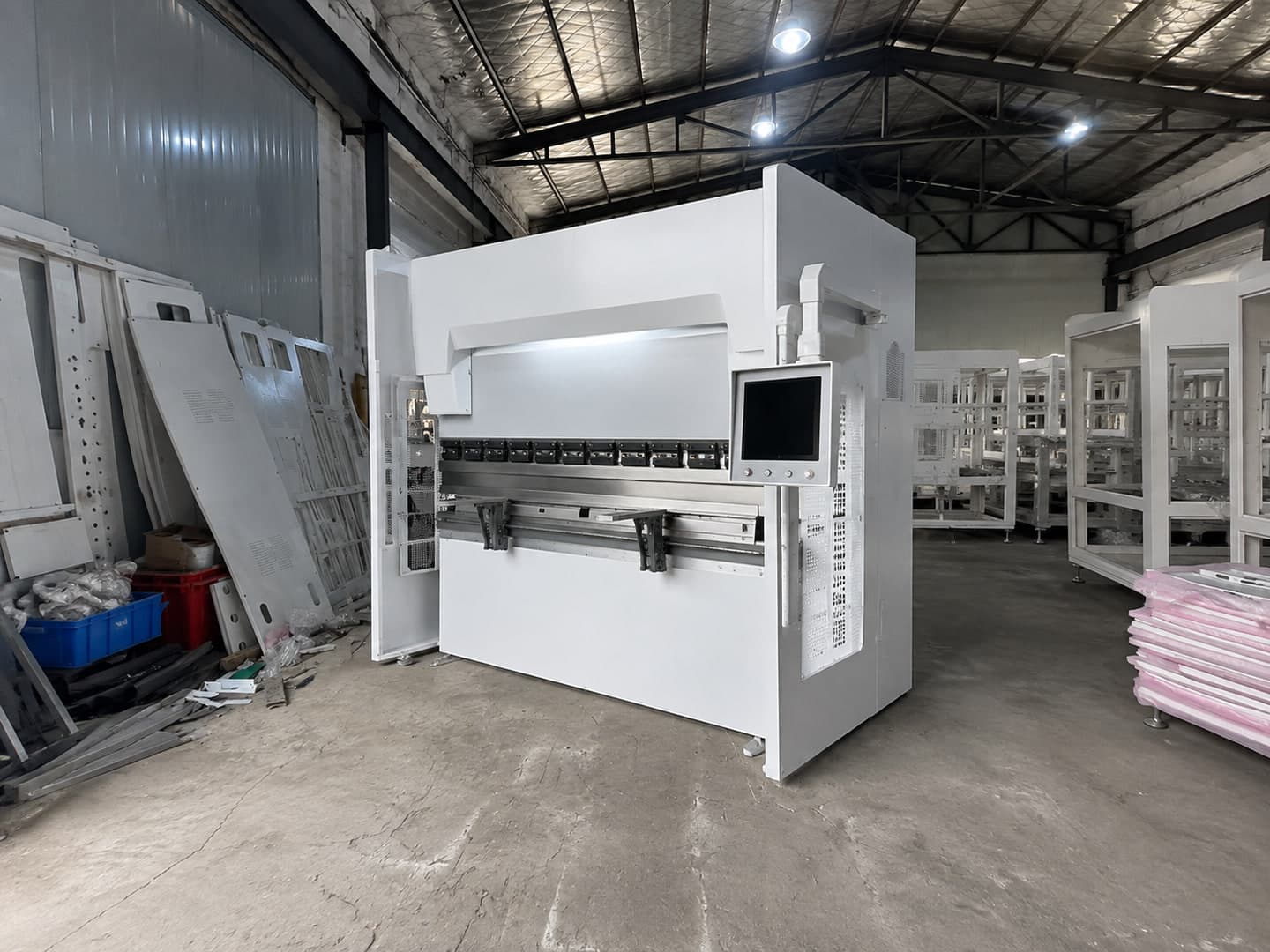 Illustrative configuration of a CNC press-brake station in a factory