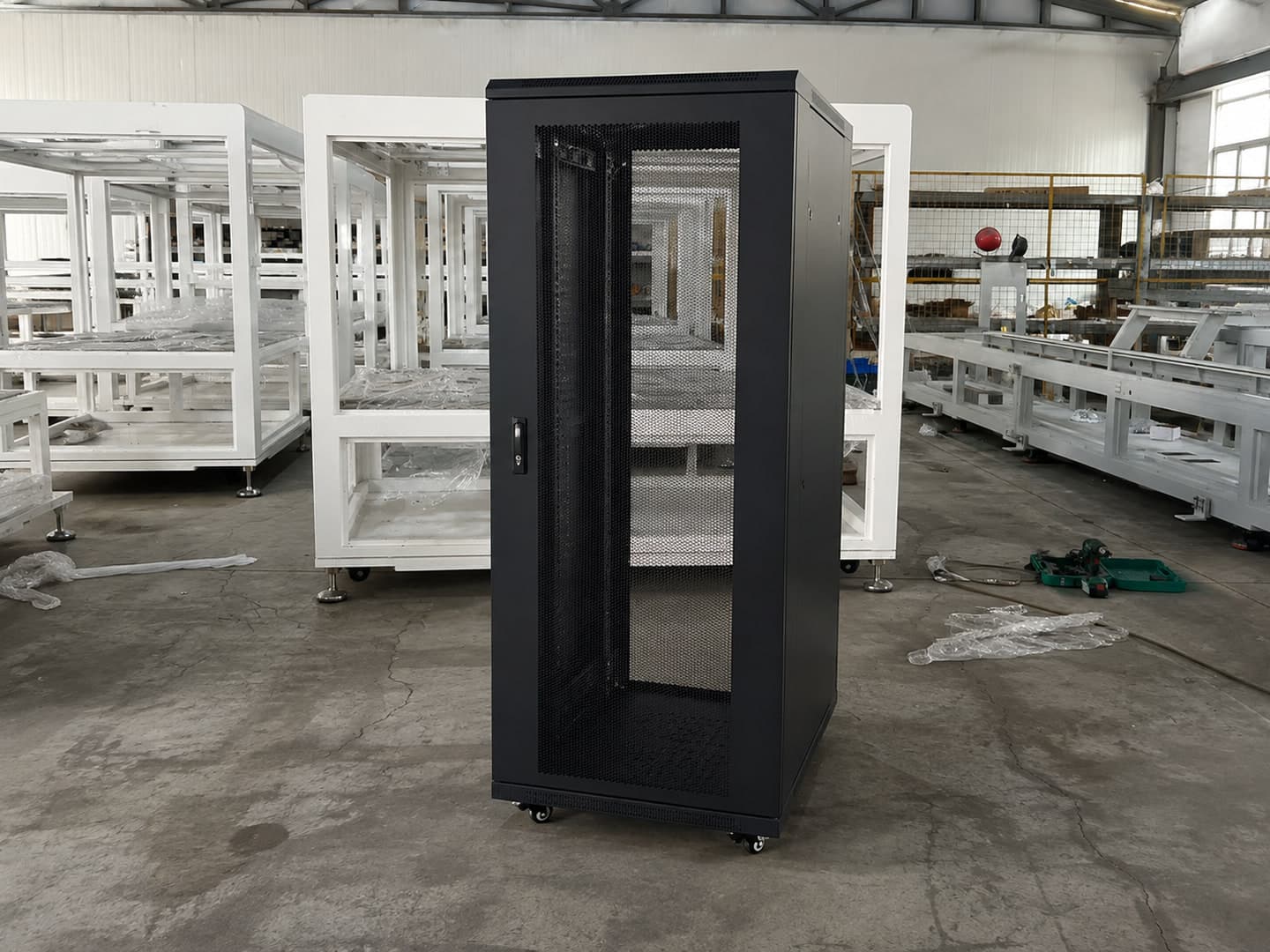 Illustrative configuration of an unpopulated data-center cabinet in a factory setting